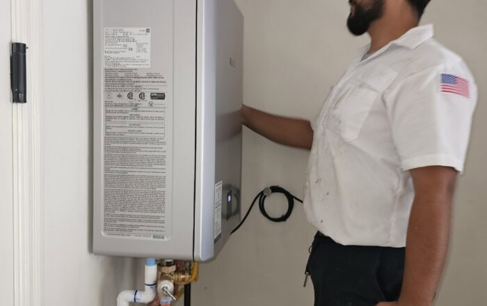 technician installing a tankless water heater in burbank, ca